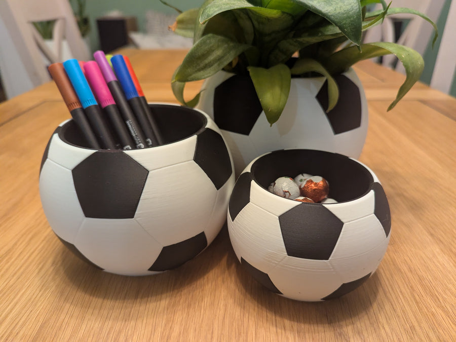 Football shaped pencil pot in use